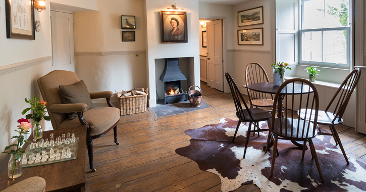 view of seating area around open fire inside historic country inn - High Force Hotel 